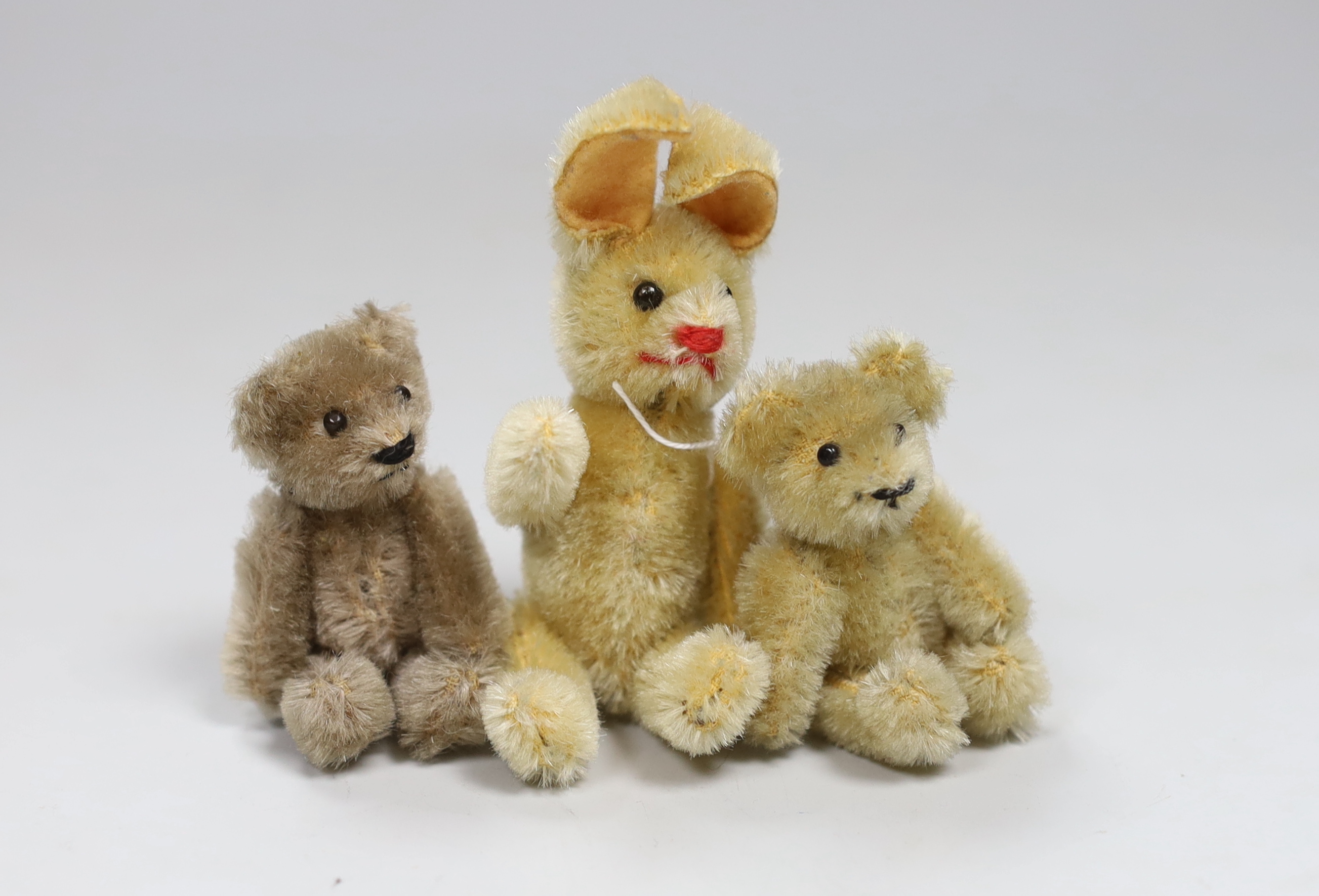 A Schuco rabbit, 1950's, good condition, and two mini Schuco bears